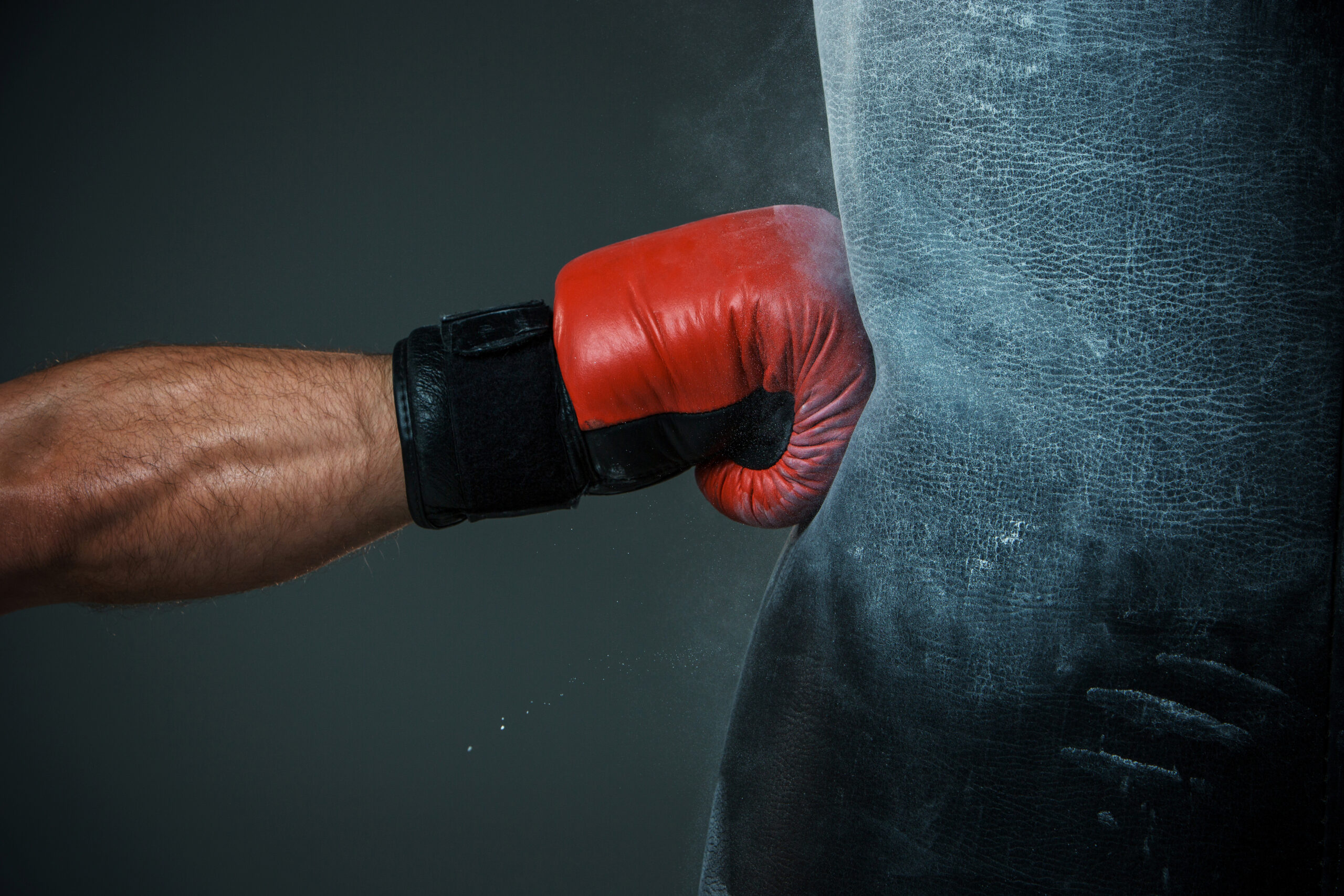A boxer trains with a punching bag
